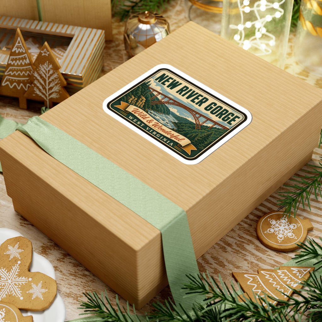 Travel sticker on wrapped gift box showing New River Gorge bridge and Wild & Wonderful West Virginia text