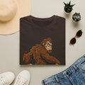 Dark brown crewneck T-shirt with brown smirking sasquatch graphic and star accents