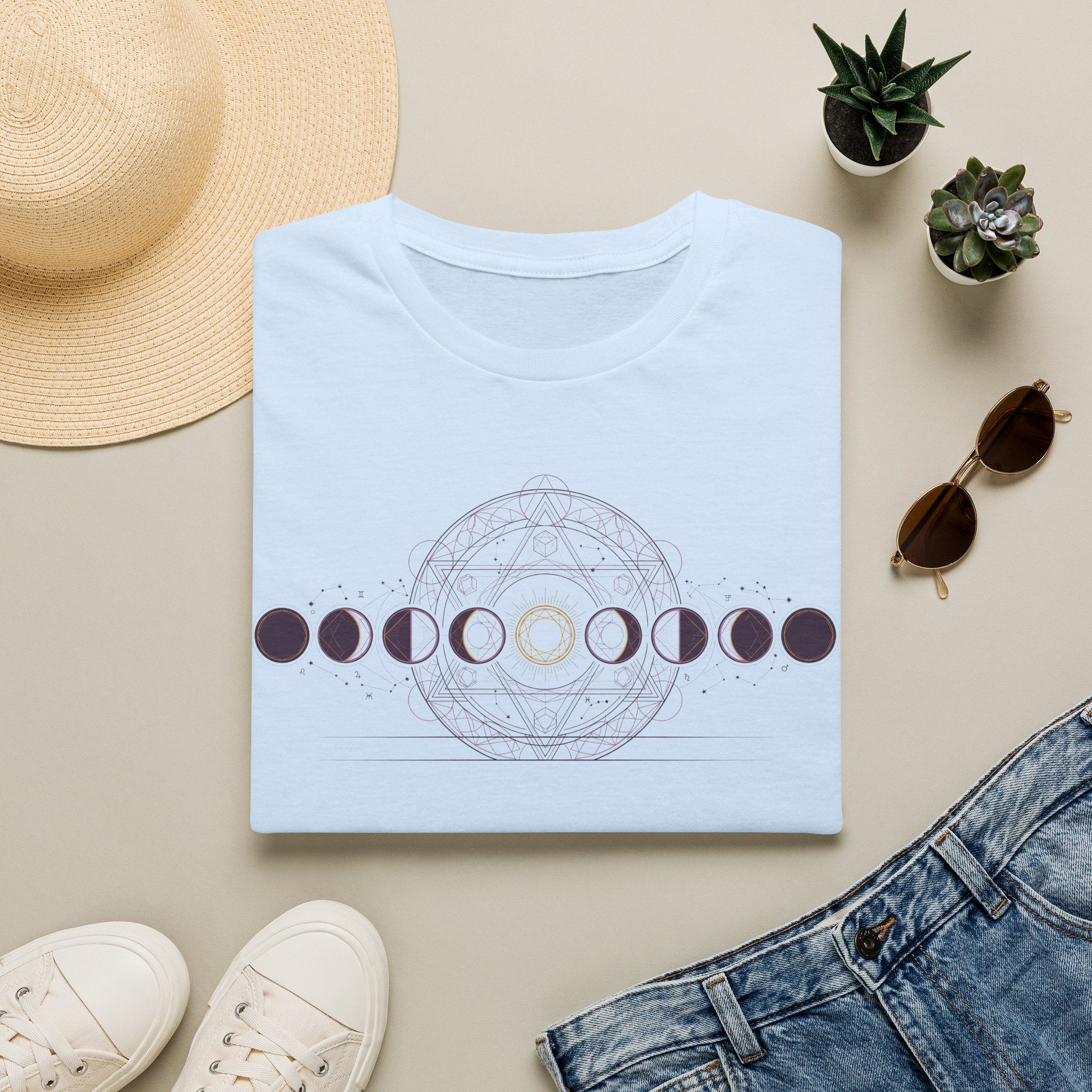 Light blue moon phases graphic t-shirt with circular dotted design across the chest