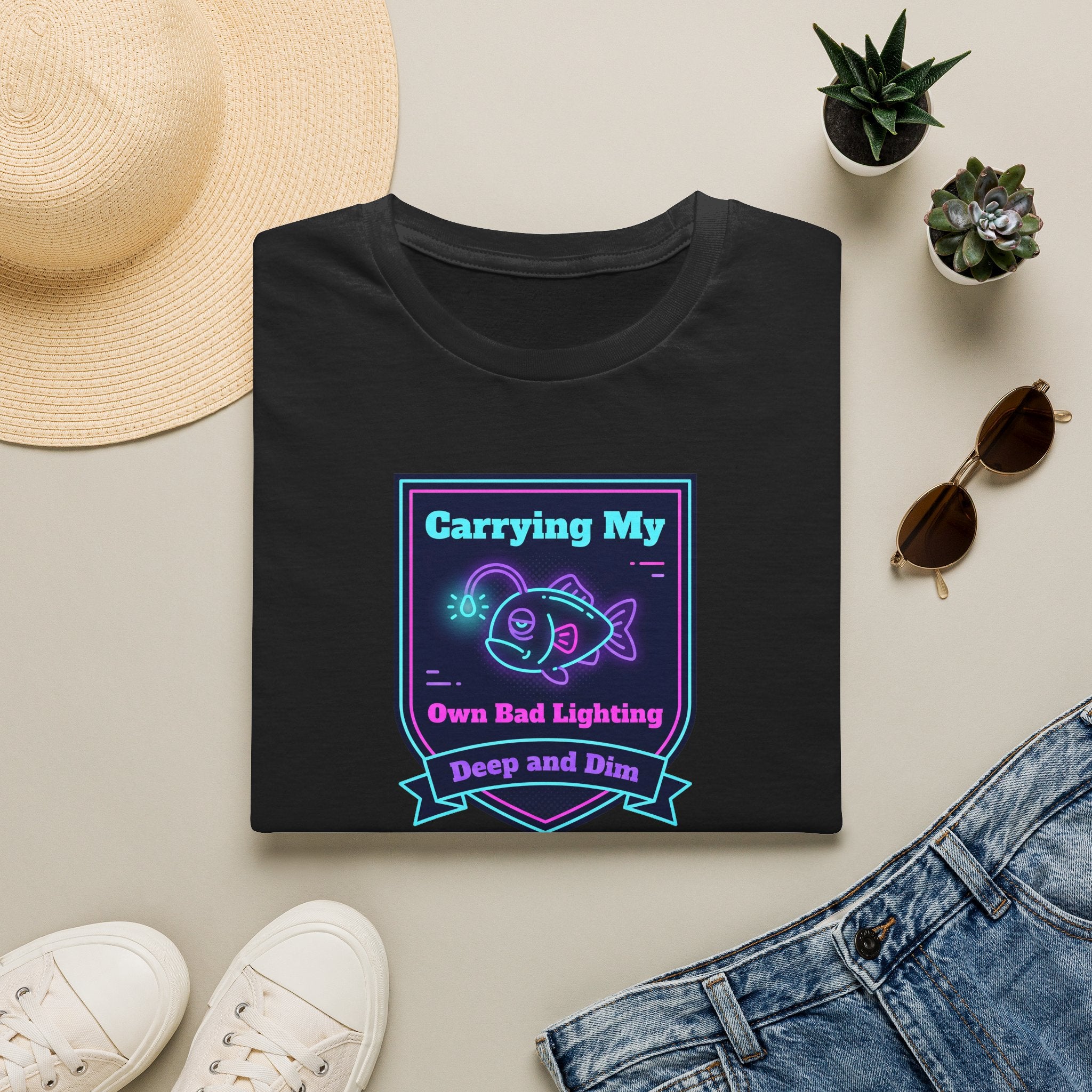 Black T-shirt with neon anglerfish graphic and ribbon text, front view