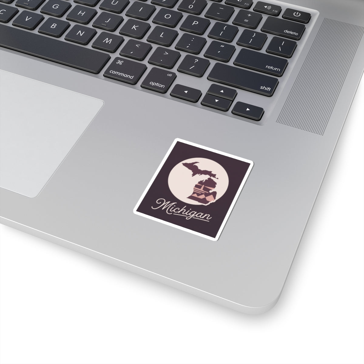 Square Michigan state silhouette sticker with maroon background and white border