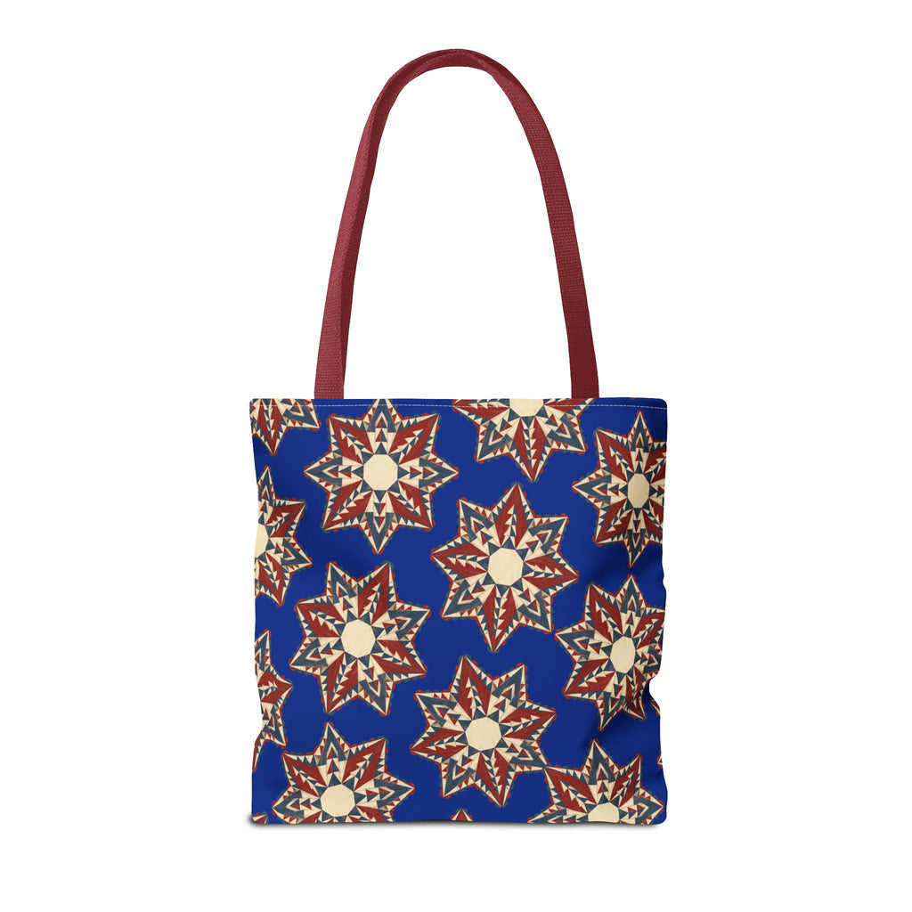 Blue tote bag with starburst floral pattern and red handles