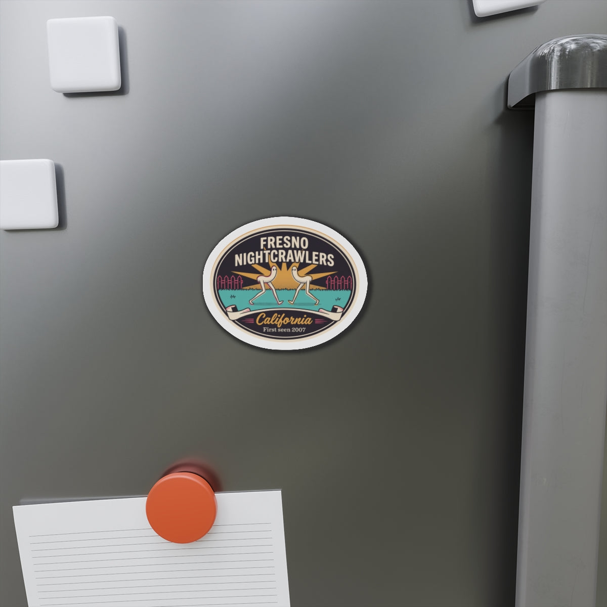 Round die-cut magnet on gray refrigerator door with California 'First seen 2007' badge.