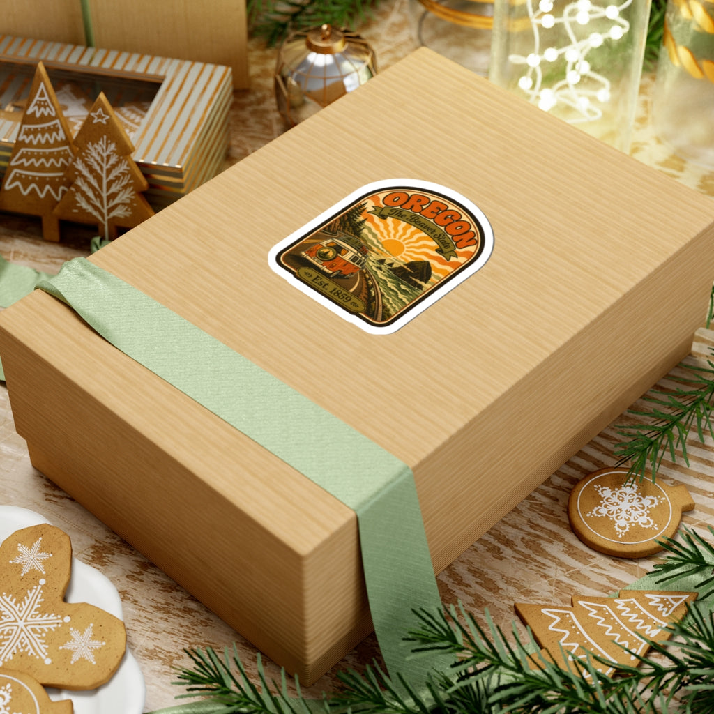 Oregon travel sticker on a wrapped gift box, with vintage van and sunburst design