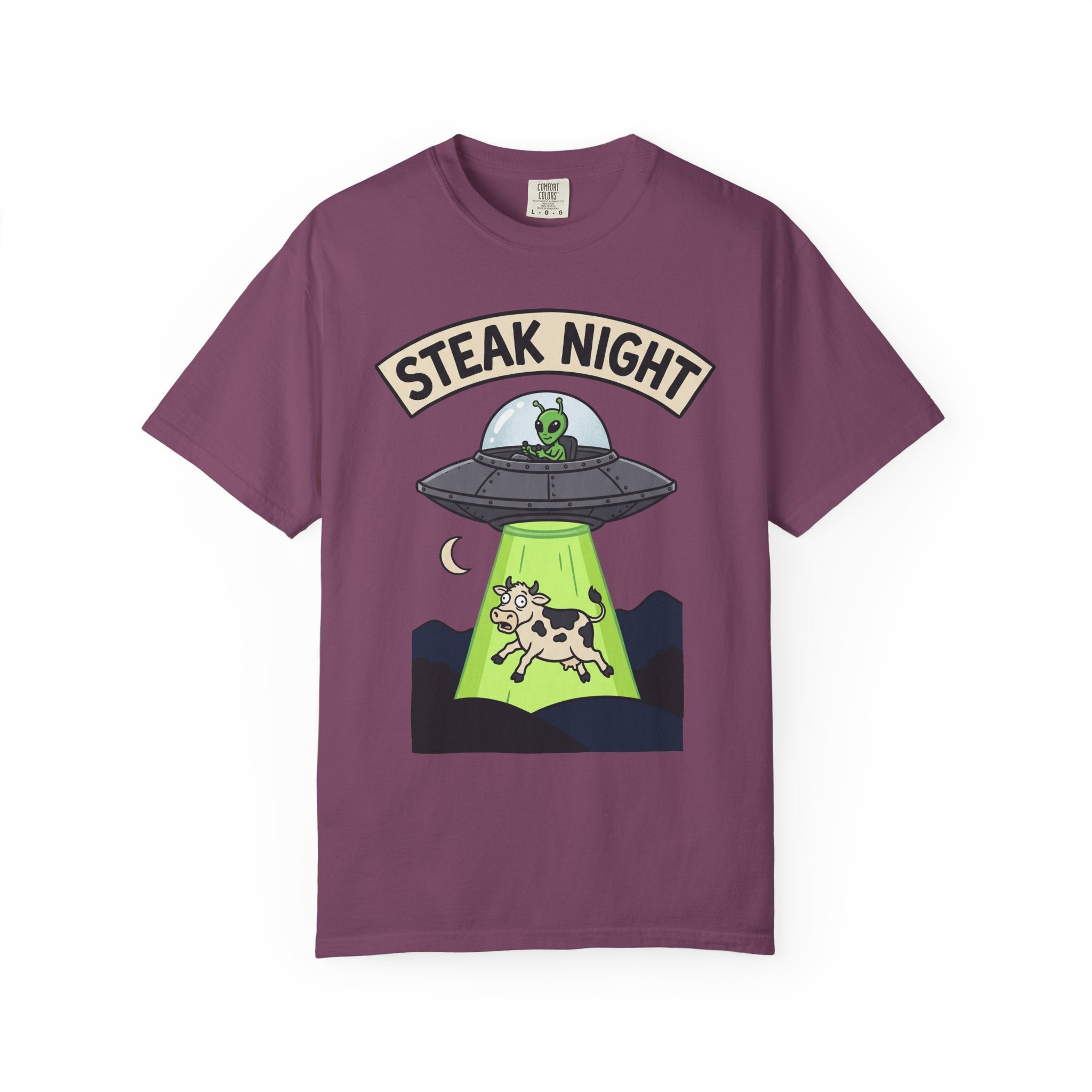 Purple T-shirt with “Steak Night” alien and cow graphic