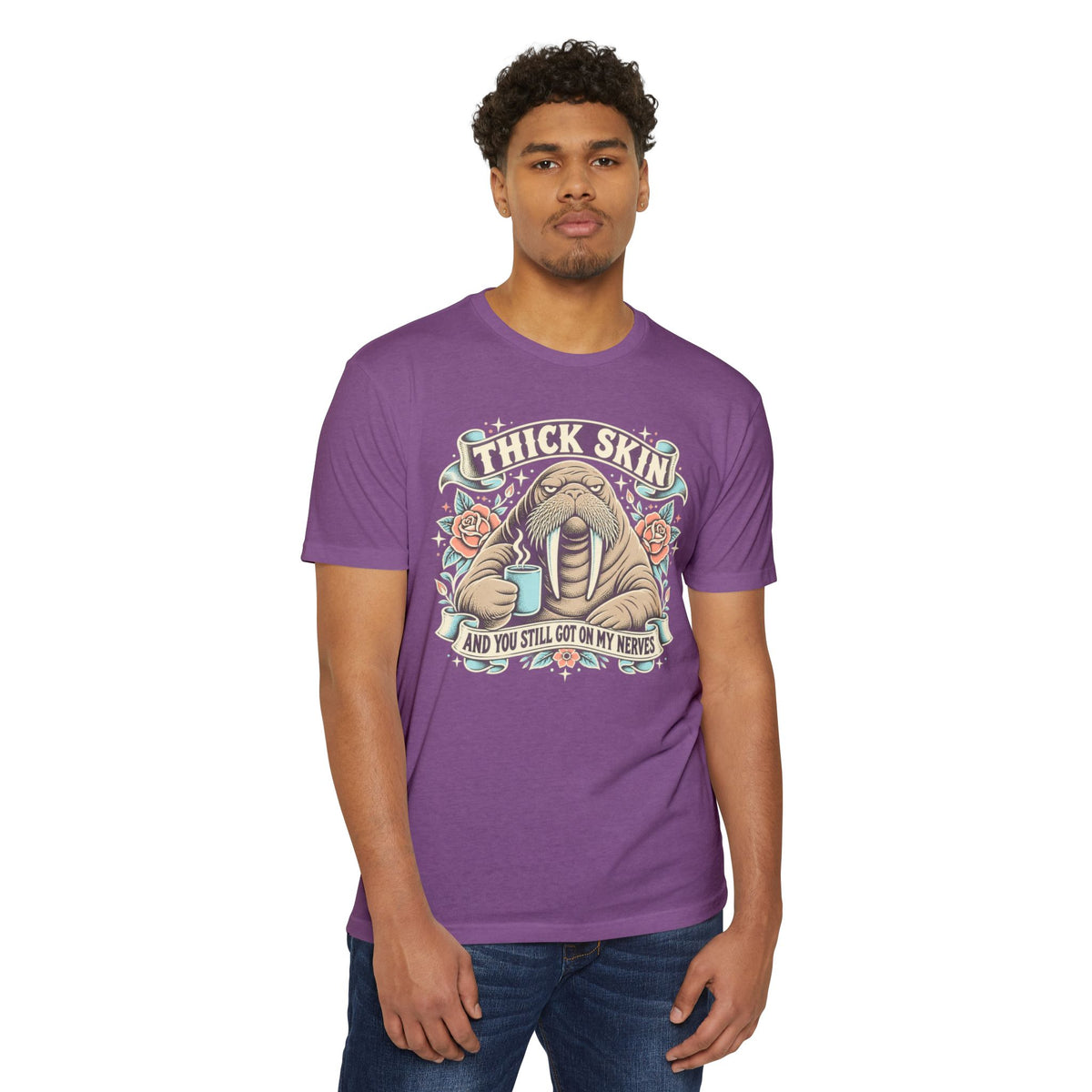Purple short-sleeve T-shirt with walrus coffee graphic and “THICK SKIN” text front