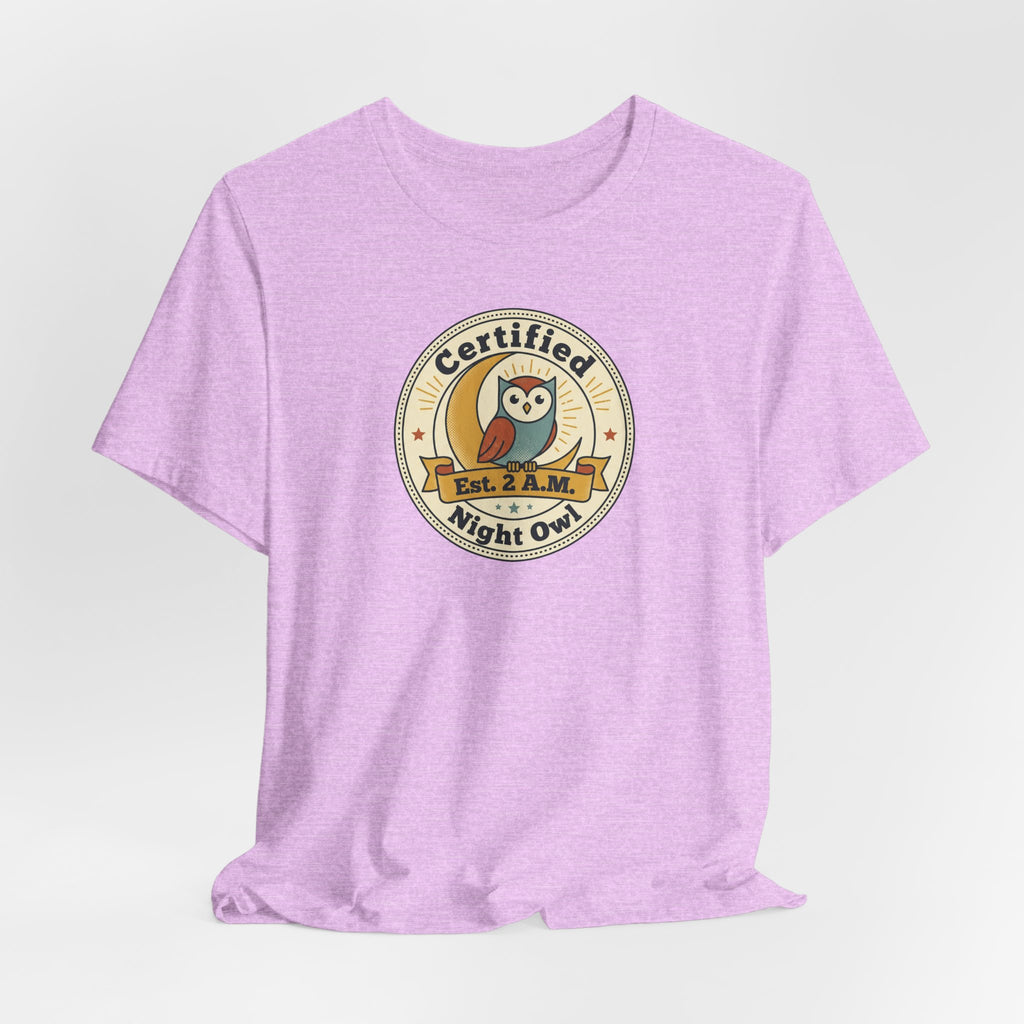 Lavender T-shirt with round Certified Night Owl badge graphic on chest