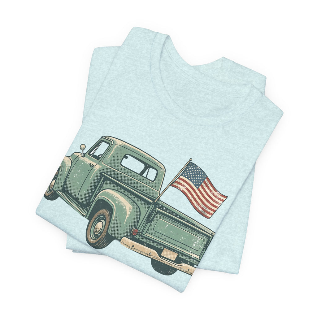 Light blue t-shirt with green pickup truck and waving American flag graphic