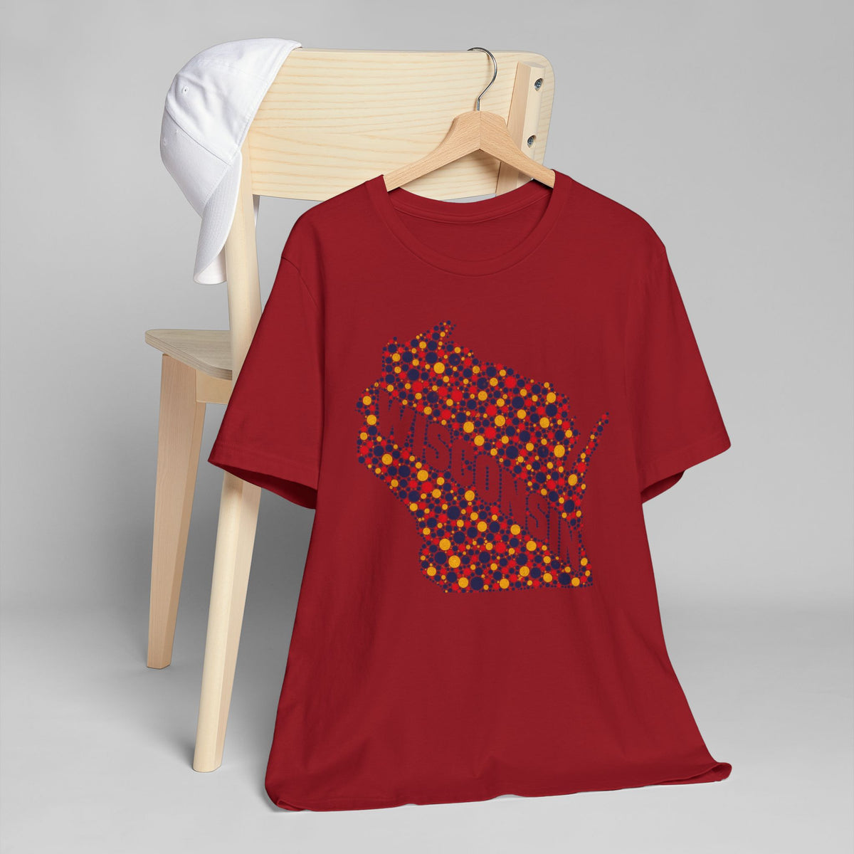 Burgundy t-shirt with colorful dotted Wisconsin map floral graphic.