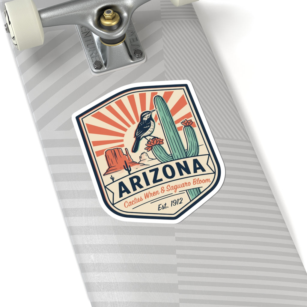 Arizona sticker badge on a striped surface, featuring cactus wren, saguaro, and Est. 1912.
