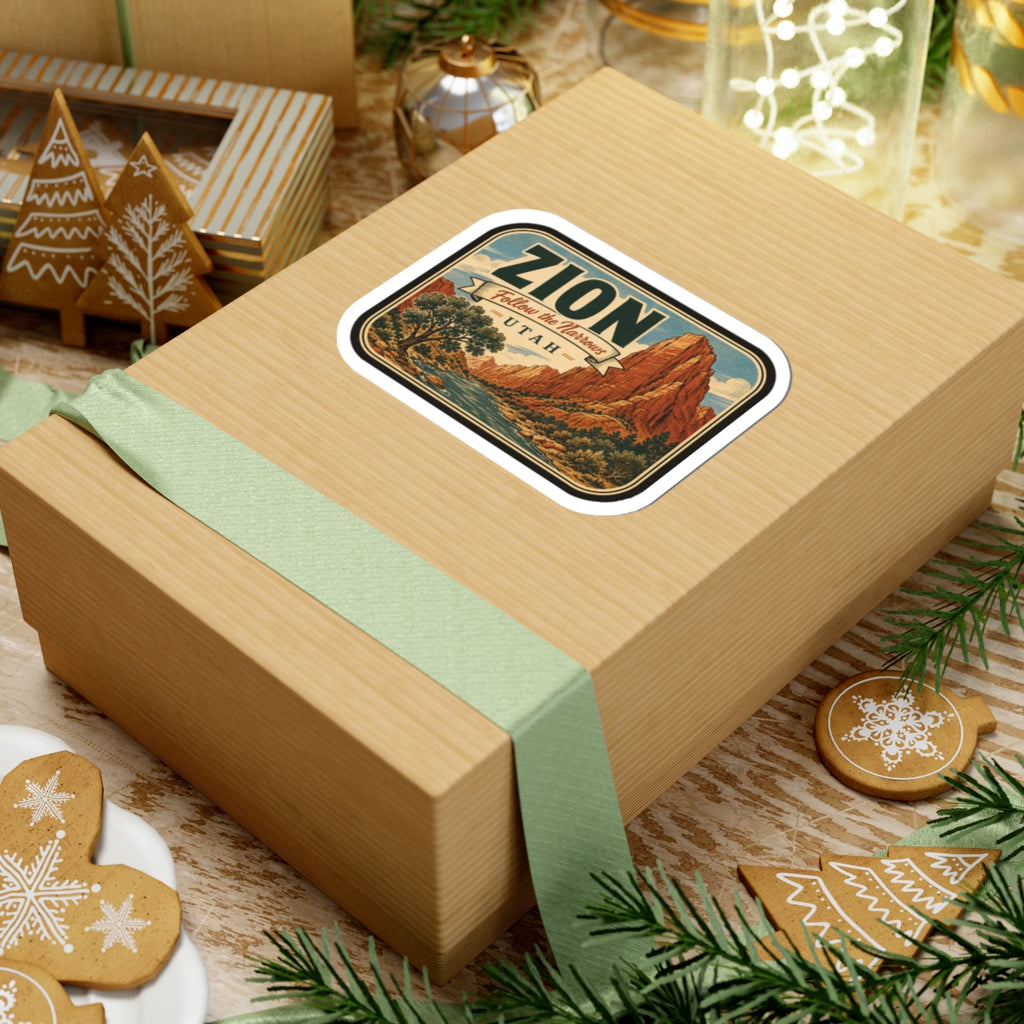 Zion sticker on wrapped present, rounded label with canyon landscape and UTAH text