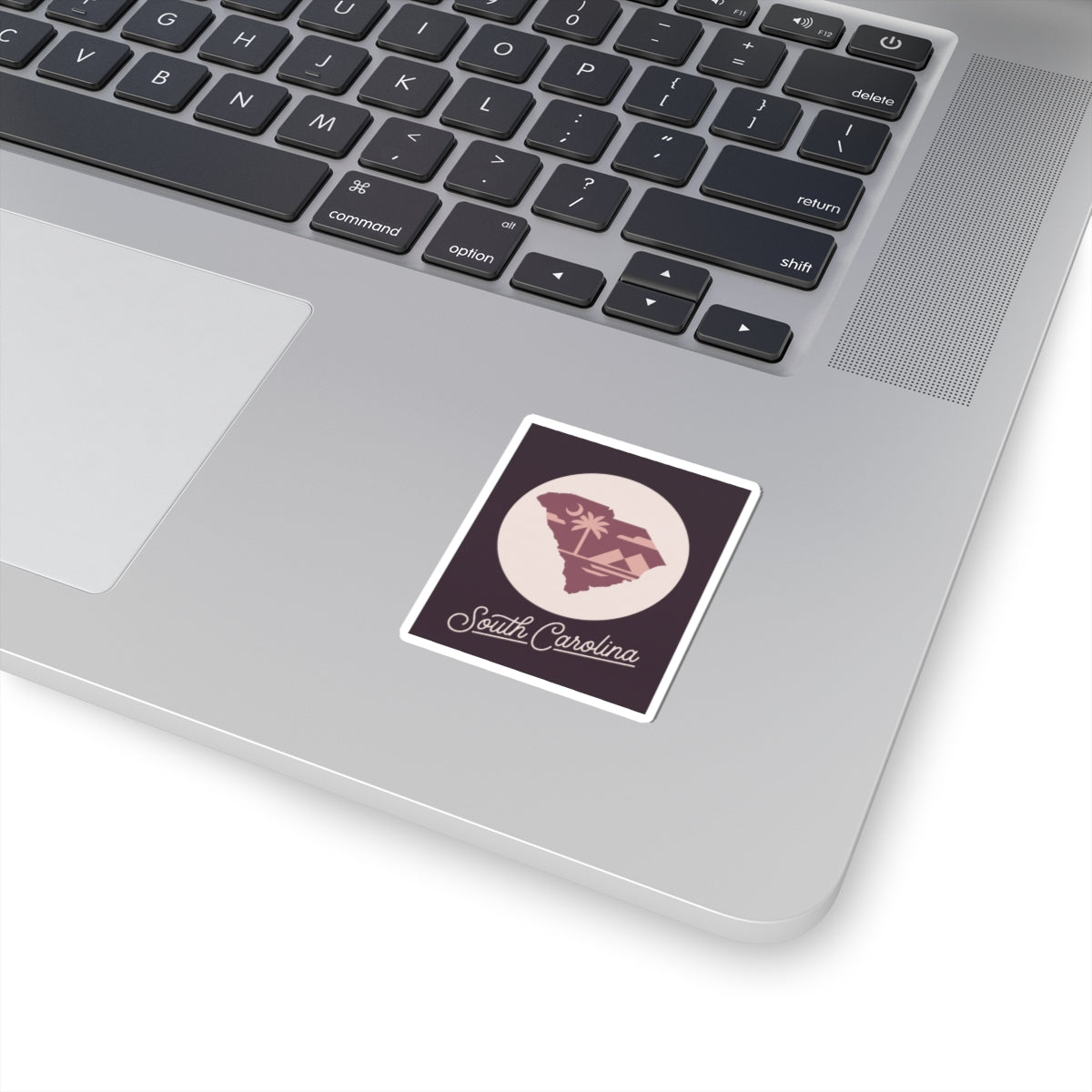 South Carolina state silhouette kiss-cut decal, maroon square with pink palm tree figure