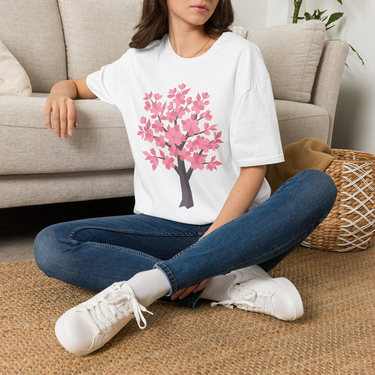 Orange unisex T-shirt with a pink cherry blossom tree graphic on the front