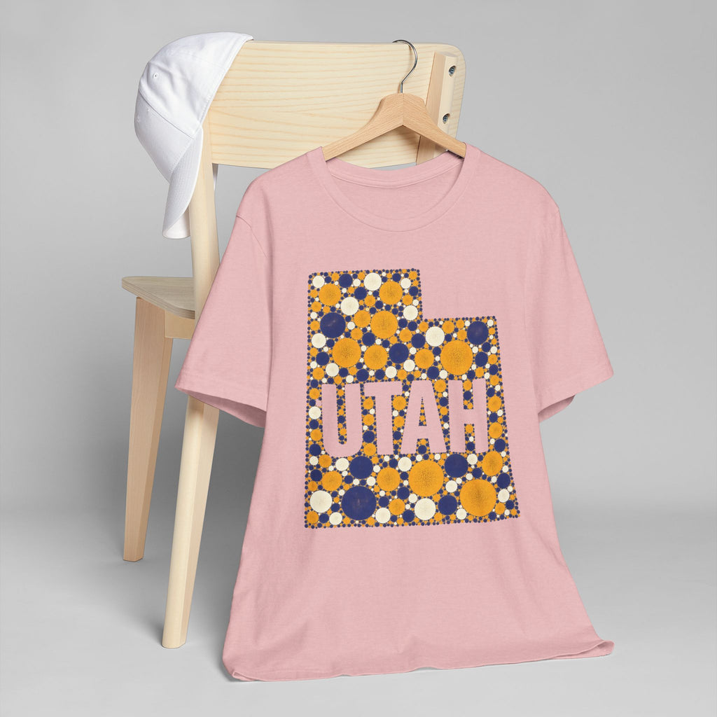 Dusty pink short-sleeve T-shirt with “UTAH” polka dot map graphic in blue and gold