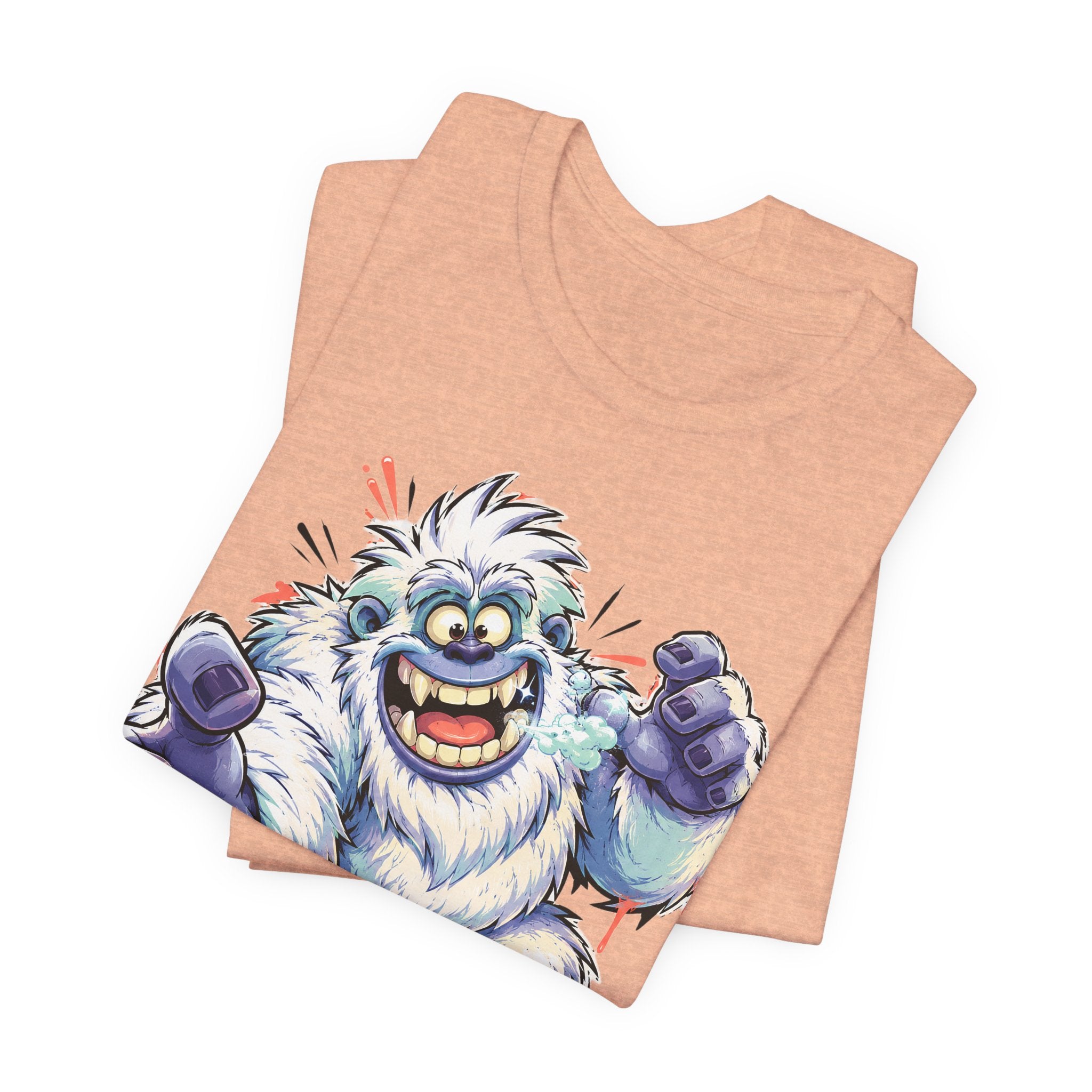 Peach T-shirt with cartoon blue yeti monster print in the center.