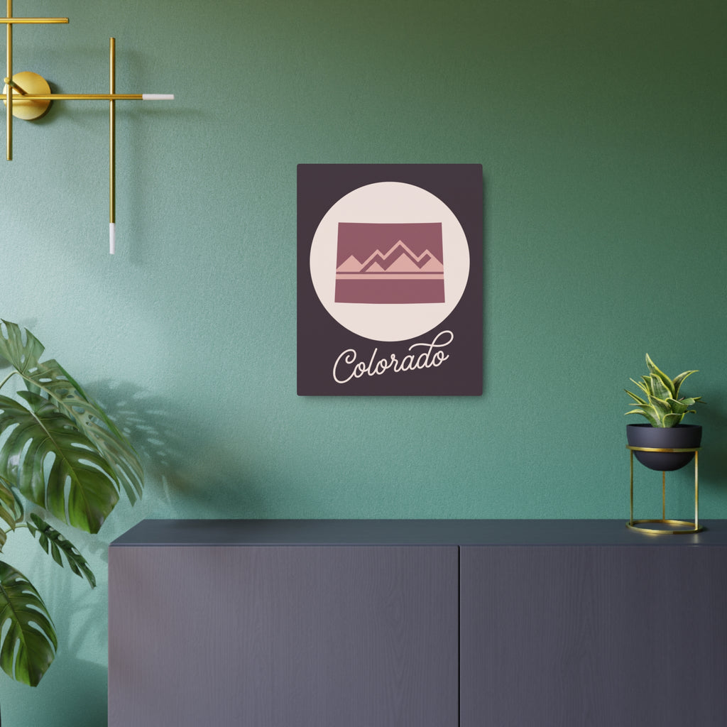 Mauve Colorado mountain silhouette metal wall art with 'Colorado' script on dark square