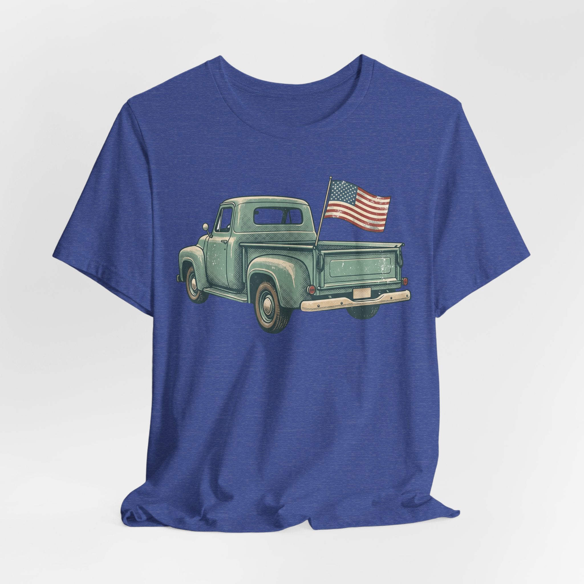 Blue crewneck T-shirt featuring a vintage green pickup truck with an American flag.
