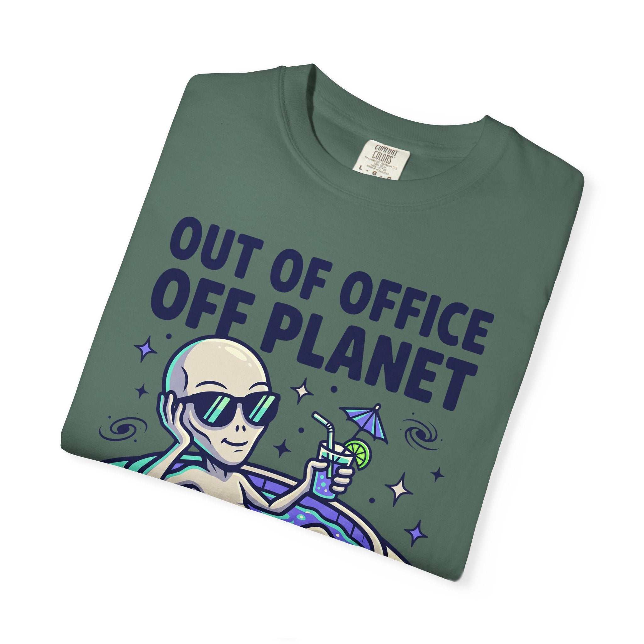 Green T-shirt with alien astronaut holding a drink in a floatie graphic on front