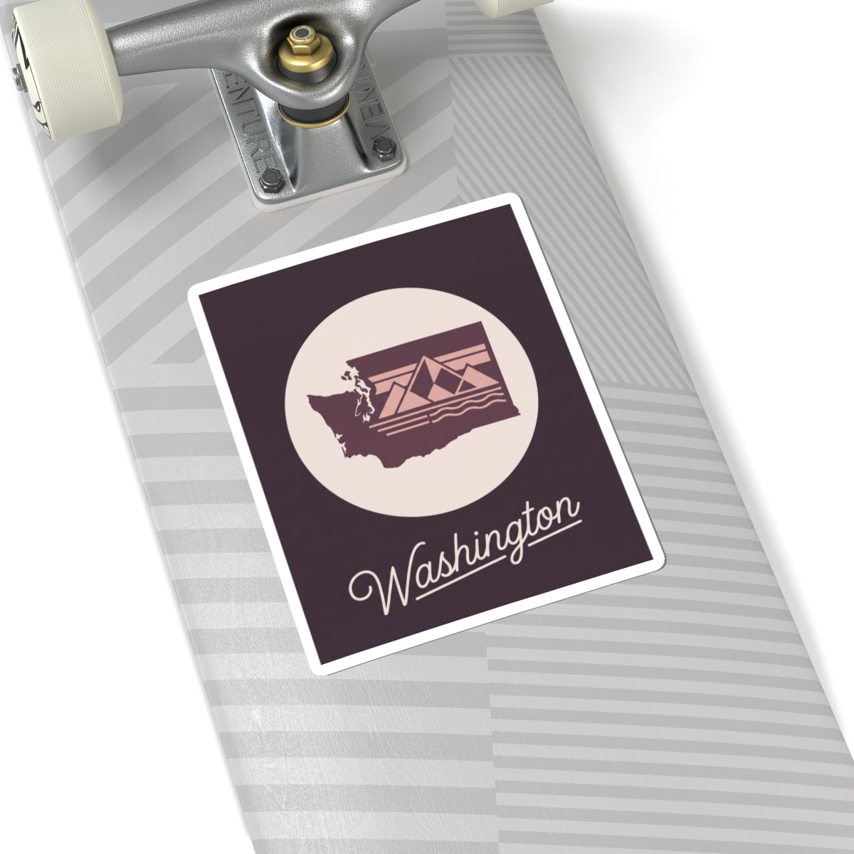 Washington state sticker on a luggage surface, round emblem with "Washington"
