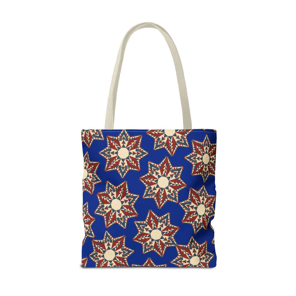 Blue tote bag with starburst floral design in cream and red, long light handles