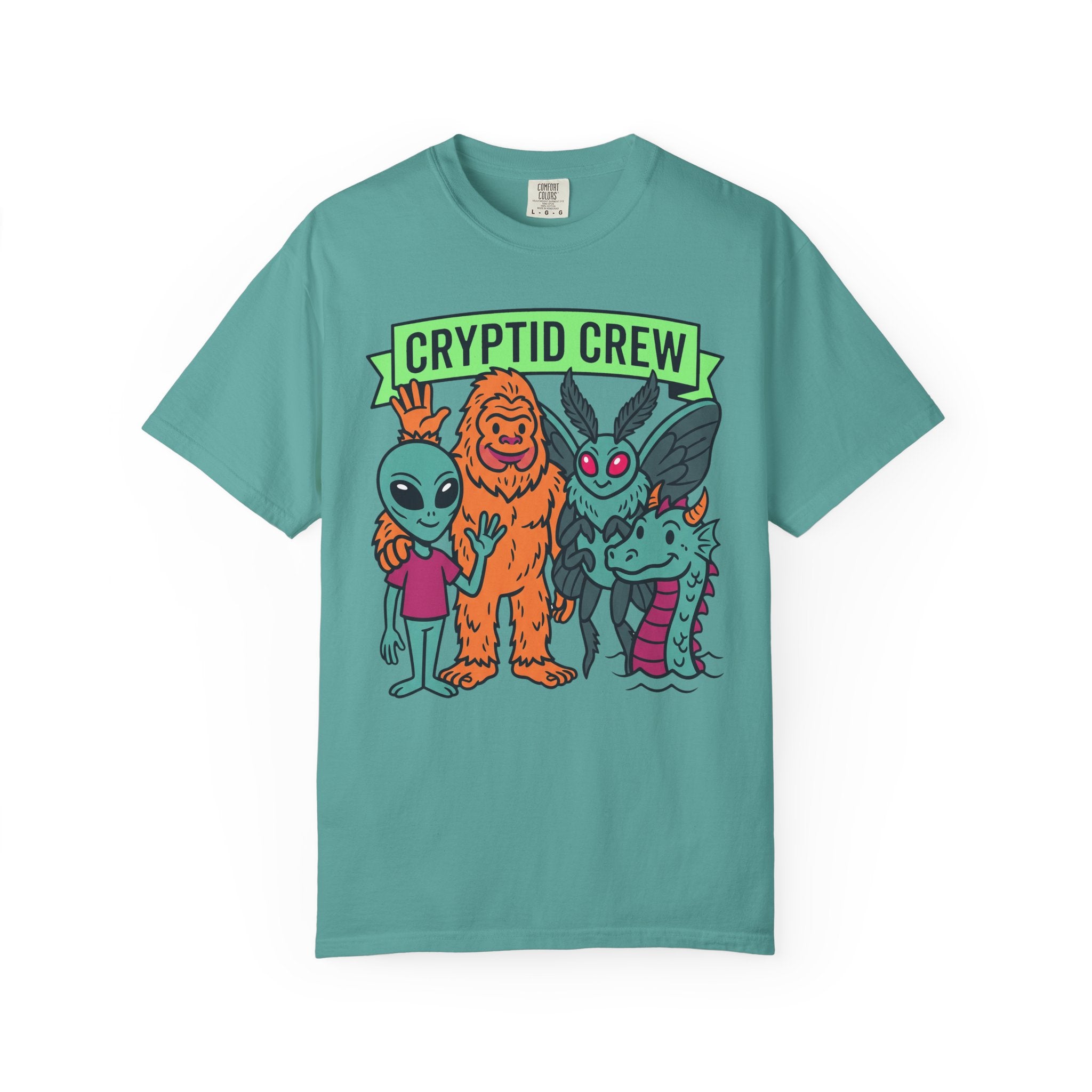 Teal crew neck t-shirt with “CRYPTID CREW” cartoon cryptid group graphic