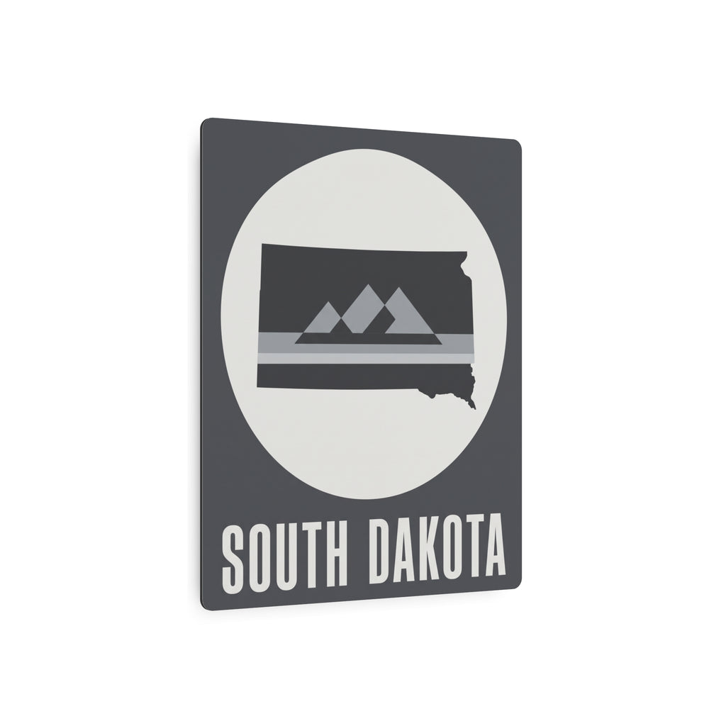 South Dakota metal wall sign, gray with oval mountain graphic and 'SOUTH DAKOTA' text
