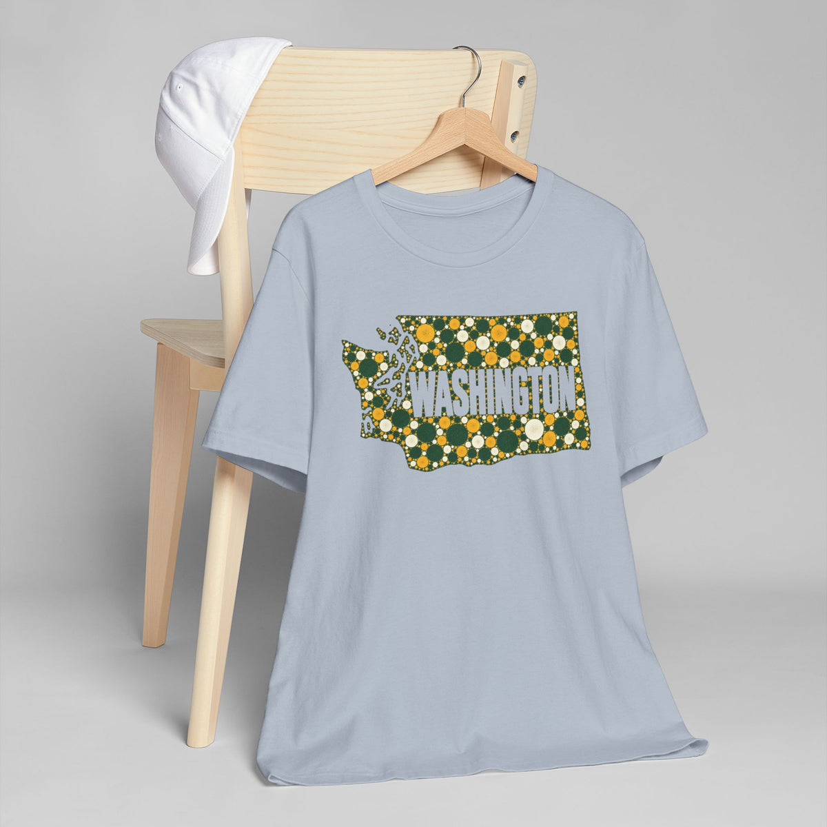 Light blue crew-neck T-shirt with gold and green floral Washington outline graphic