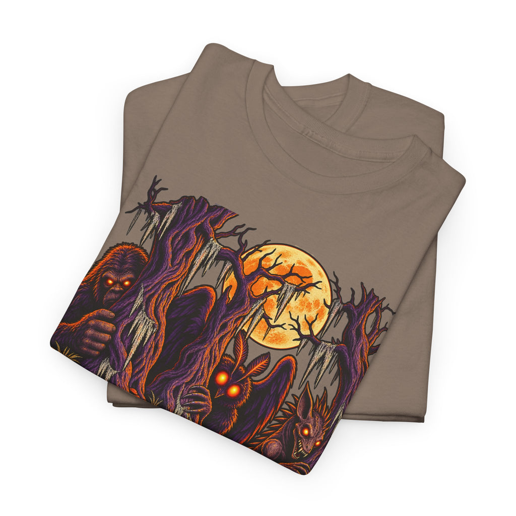 Brown Halloween monster graphic T-shirt with haunted forest and glowing pumpkin face.