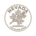 Circular Nevada transparent vinyl sticker with sagebrush graphic and Silver State text