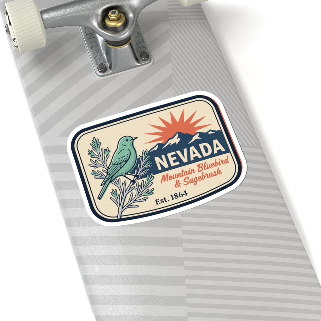 Nevada badge decal sticker on a striped surface, featuring bluebird, sagebrush, mountain, Est. 1864.