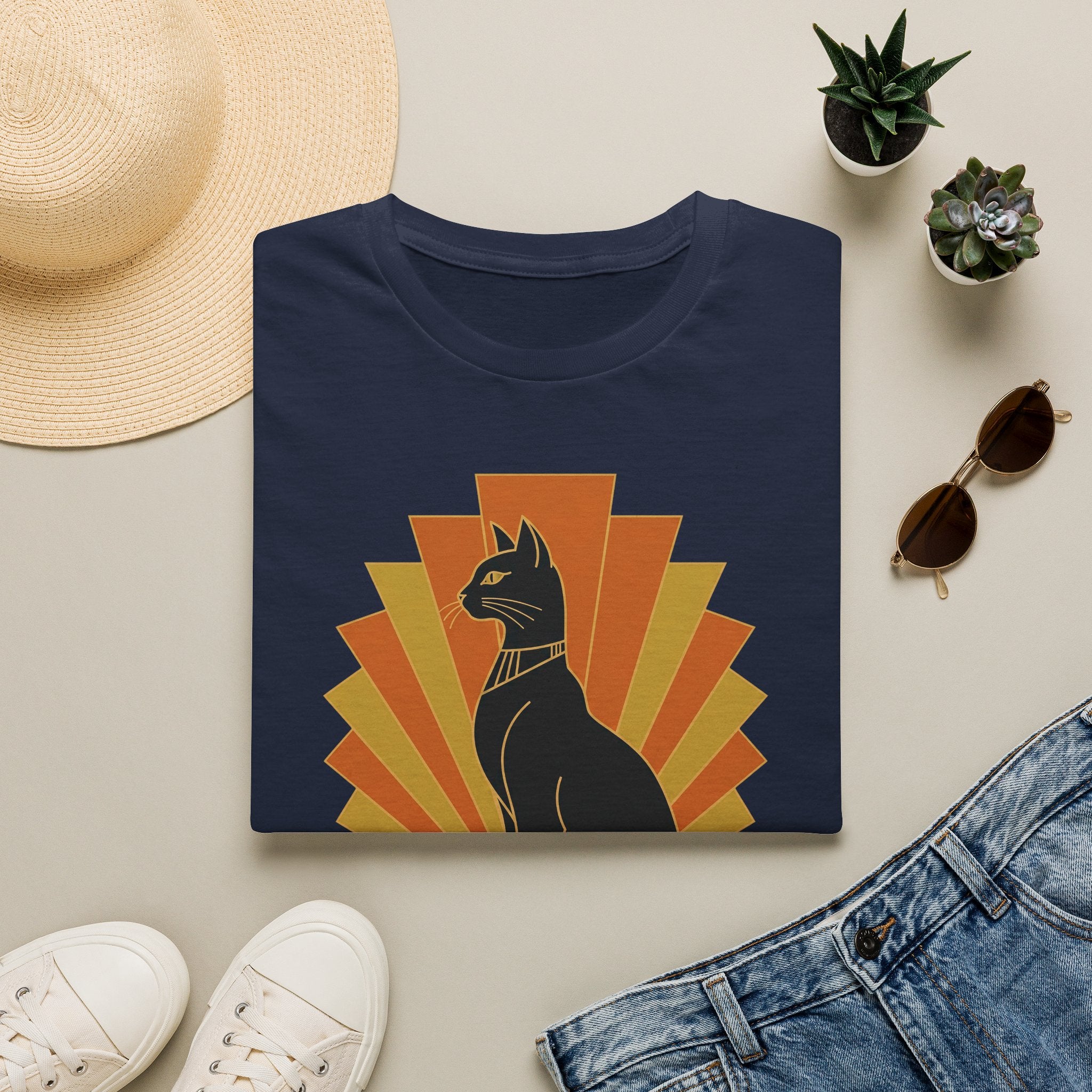 Navy T-shirt with black Egyptian cat wearing headdress, orange sunburst front graphic.
