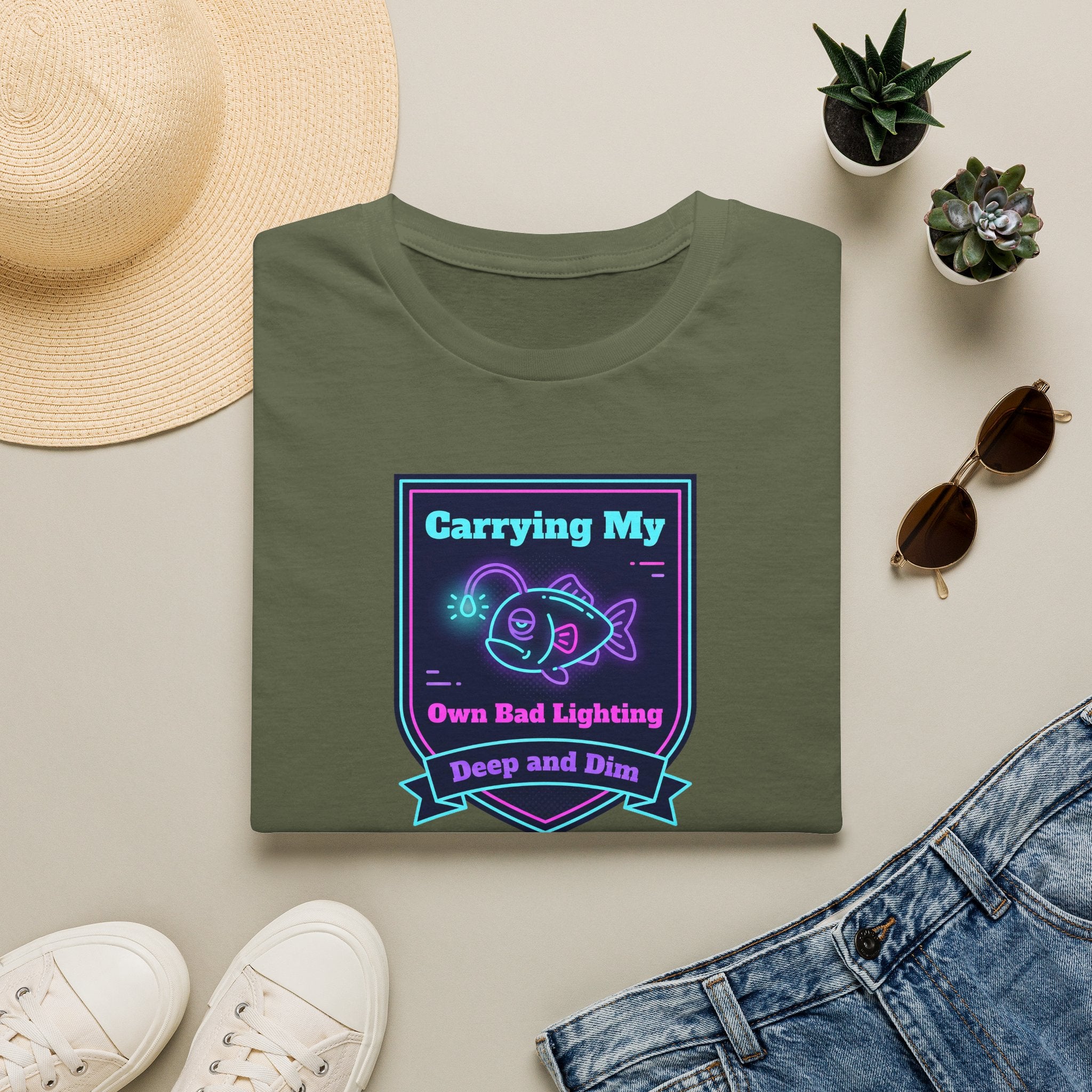 Military green T-shirt with neon anglerfish graphic and ribbon text, front view