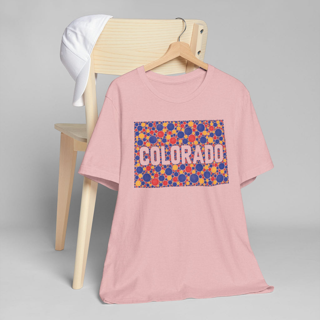 Pink crew-neck short-sleeve t-shirt with colorful “COLORADO” rectangle graphic