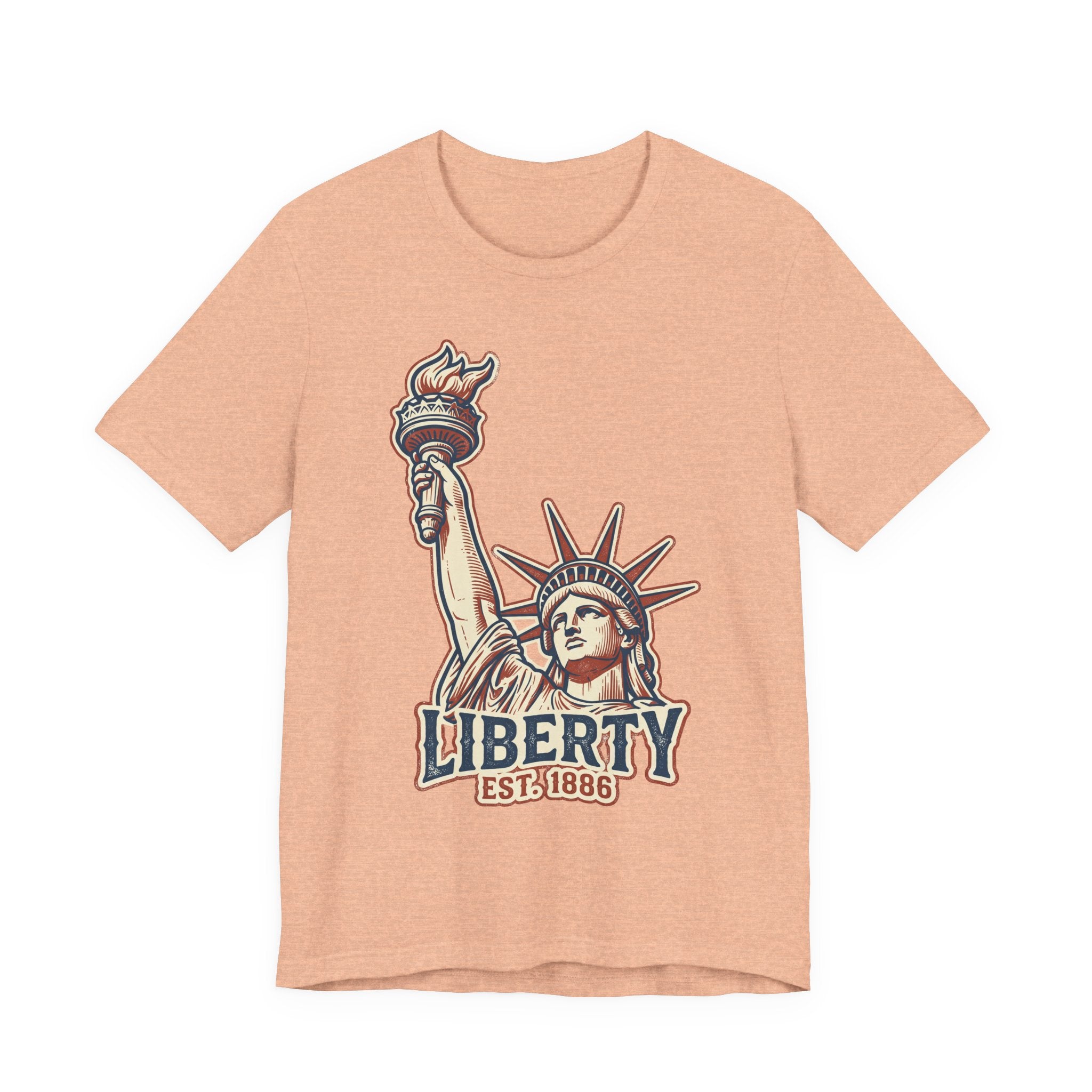 Heather peach crewneck graphic T-shirt with Statue of Liberty and “LIBERTY EST. 1886”