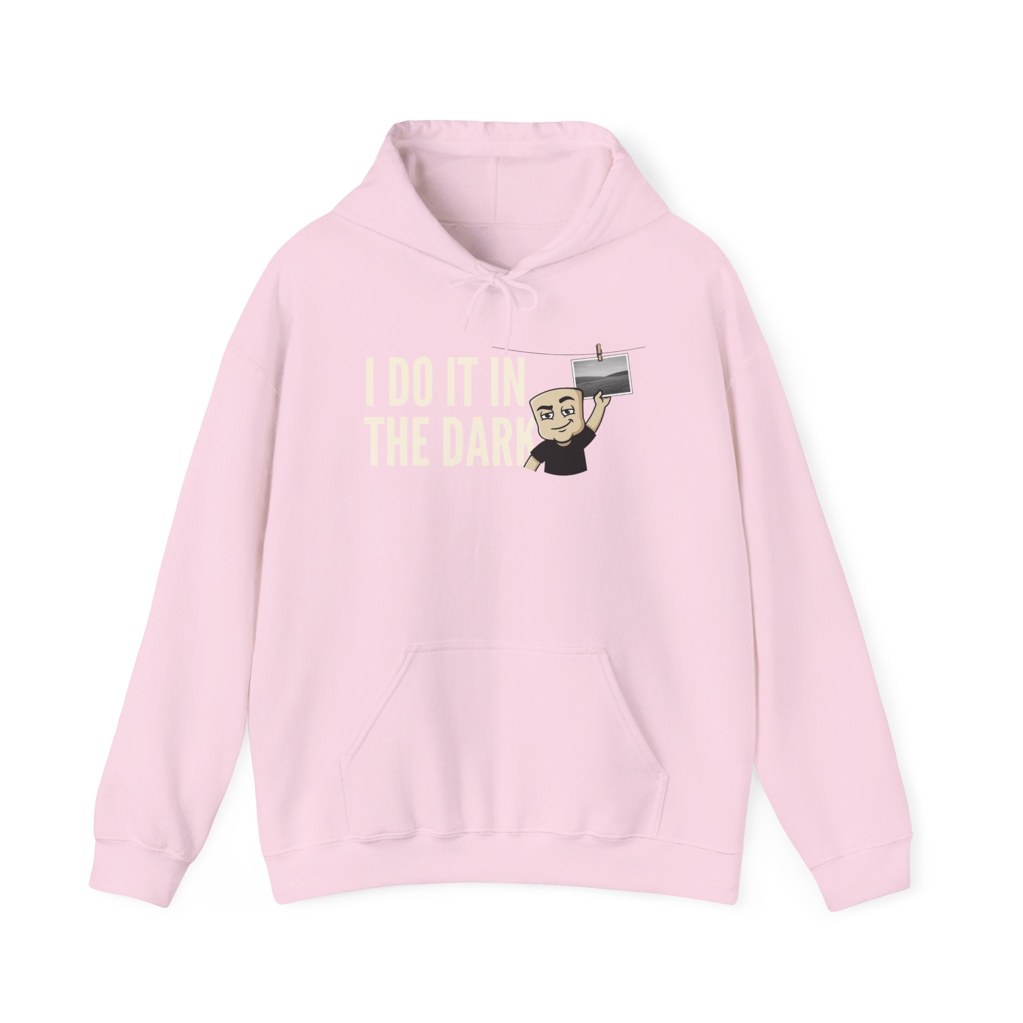 Pink hoodie with front kangaroo pocket, drawstring hood, and “I DO IT IN THE DARK” graphic