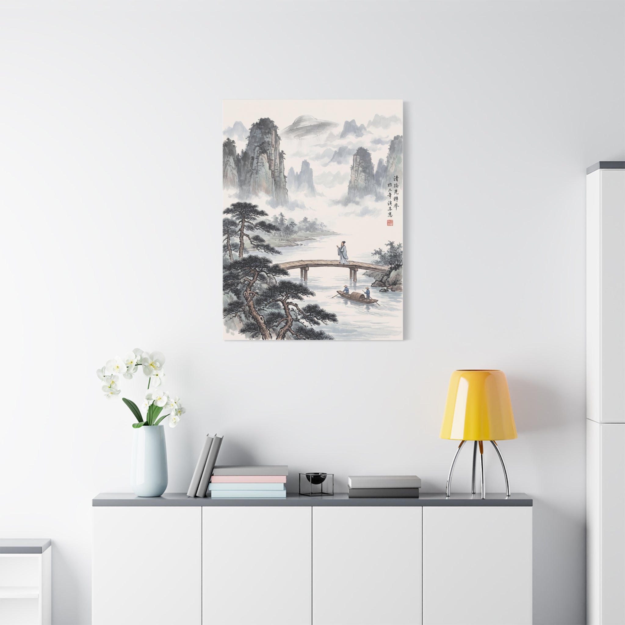 Square landscape wall art print with misty peaks, pine branches, lake, and boats