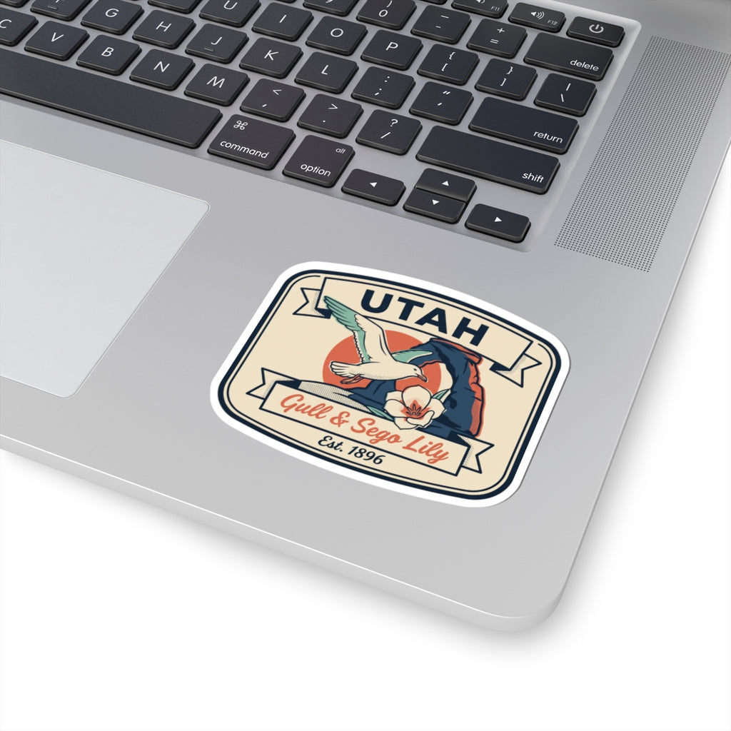 Utah badge sticker on a laptop surface with gull, sego lily, and Est. 1896