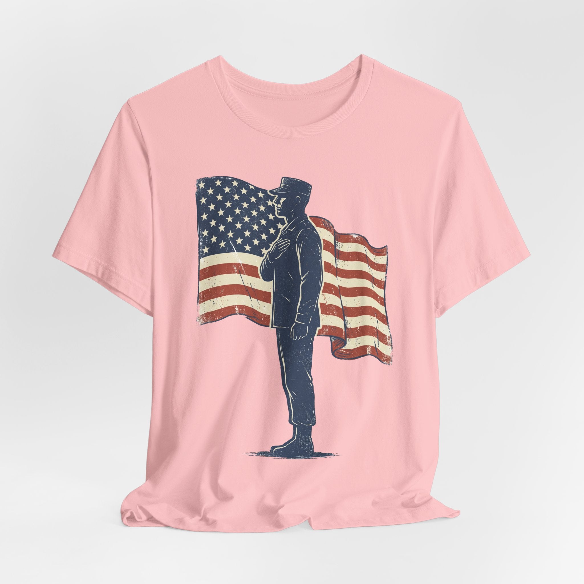 Light pink crew-neck T-shirt with saluting soldier and waving American flag print