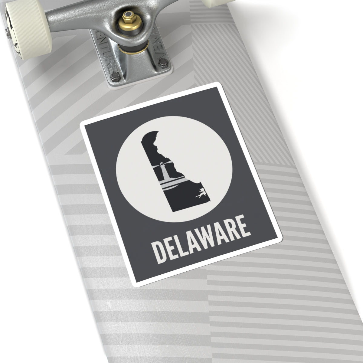 Delaware state silhouette vinyl decal on notebook, black badge with white circle and DELAWARE