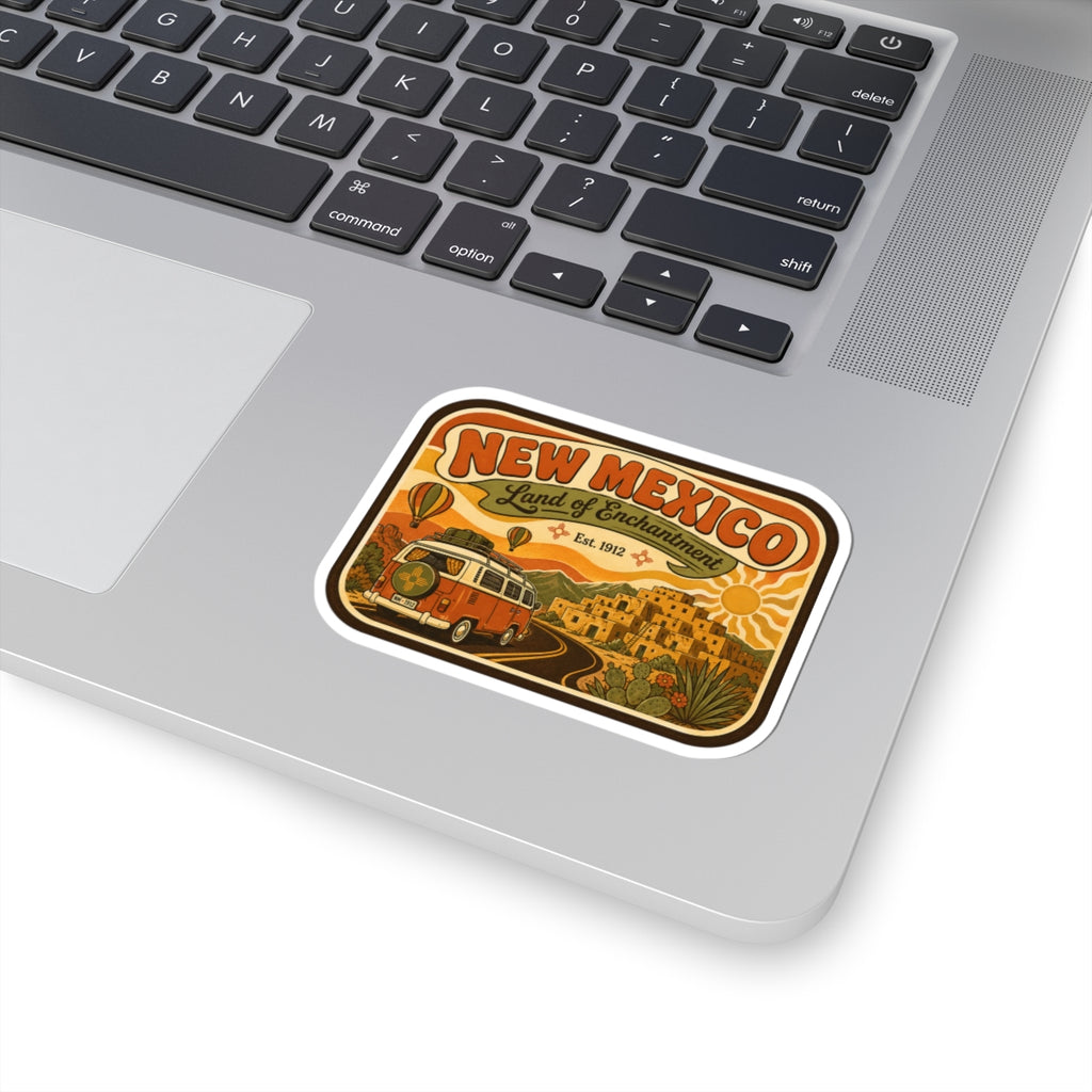 Die-cut New Mexico sticker with vintage camper, desert town, and “Land of Enchantment” title