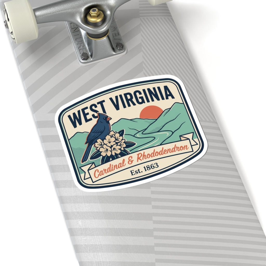West Virginia sticker on a striped notebook, cardinal and rhododendron, Est. 1863.