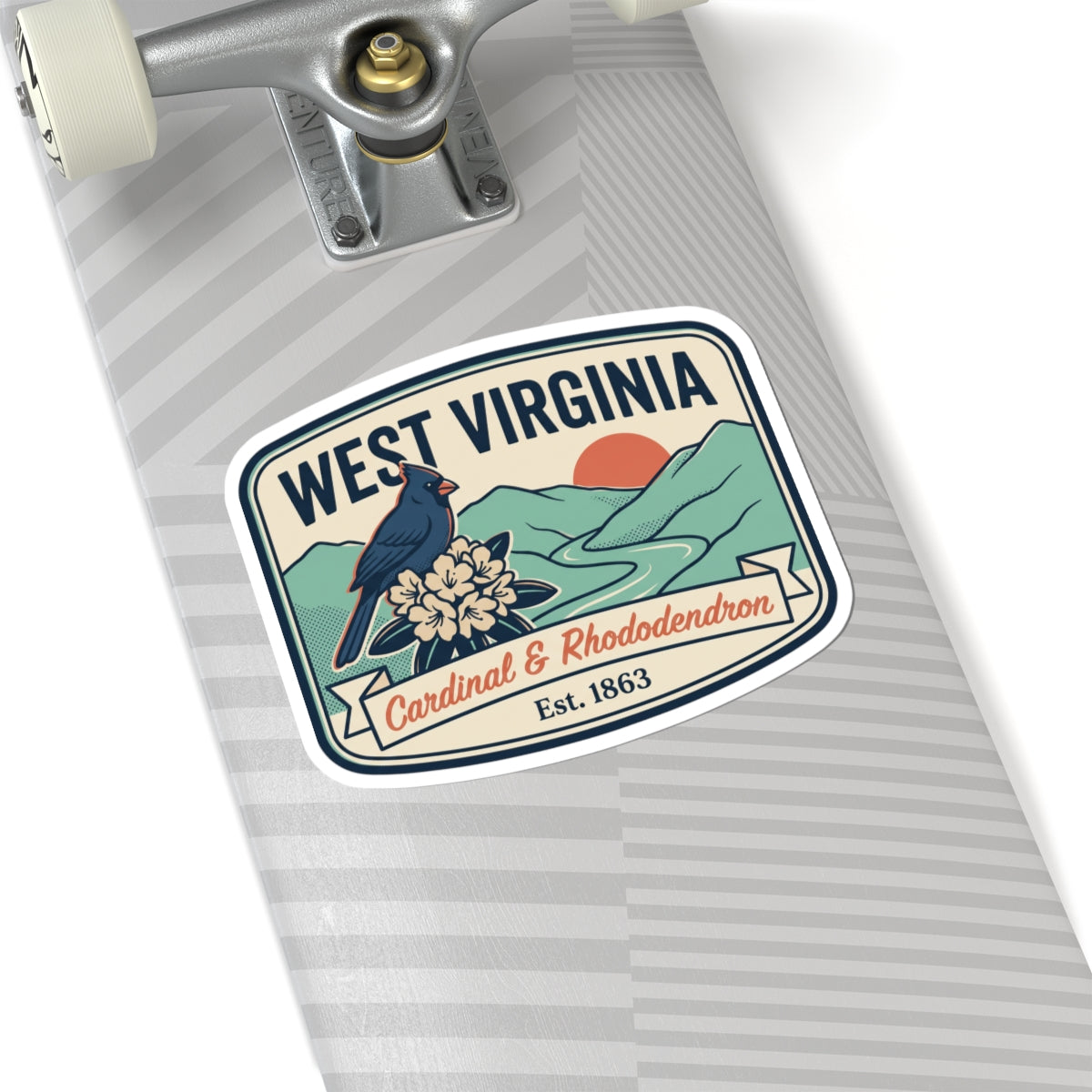 West Virginia sticker on a striped notebook, cardinal and rhododendron, Est. 1863.