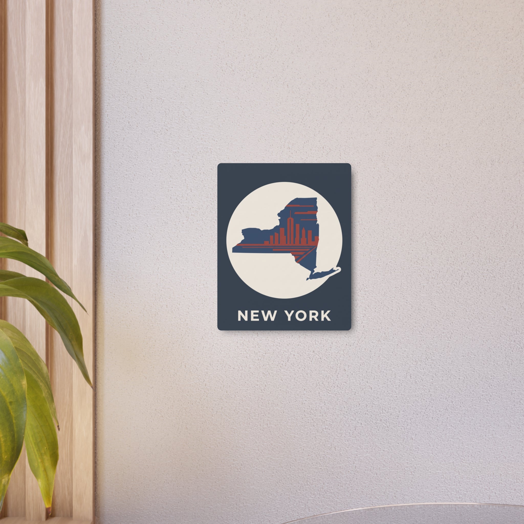 Small dark blue metal wall sign with circular New York skyline graphic and NEW YORK text