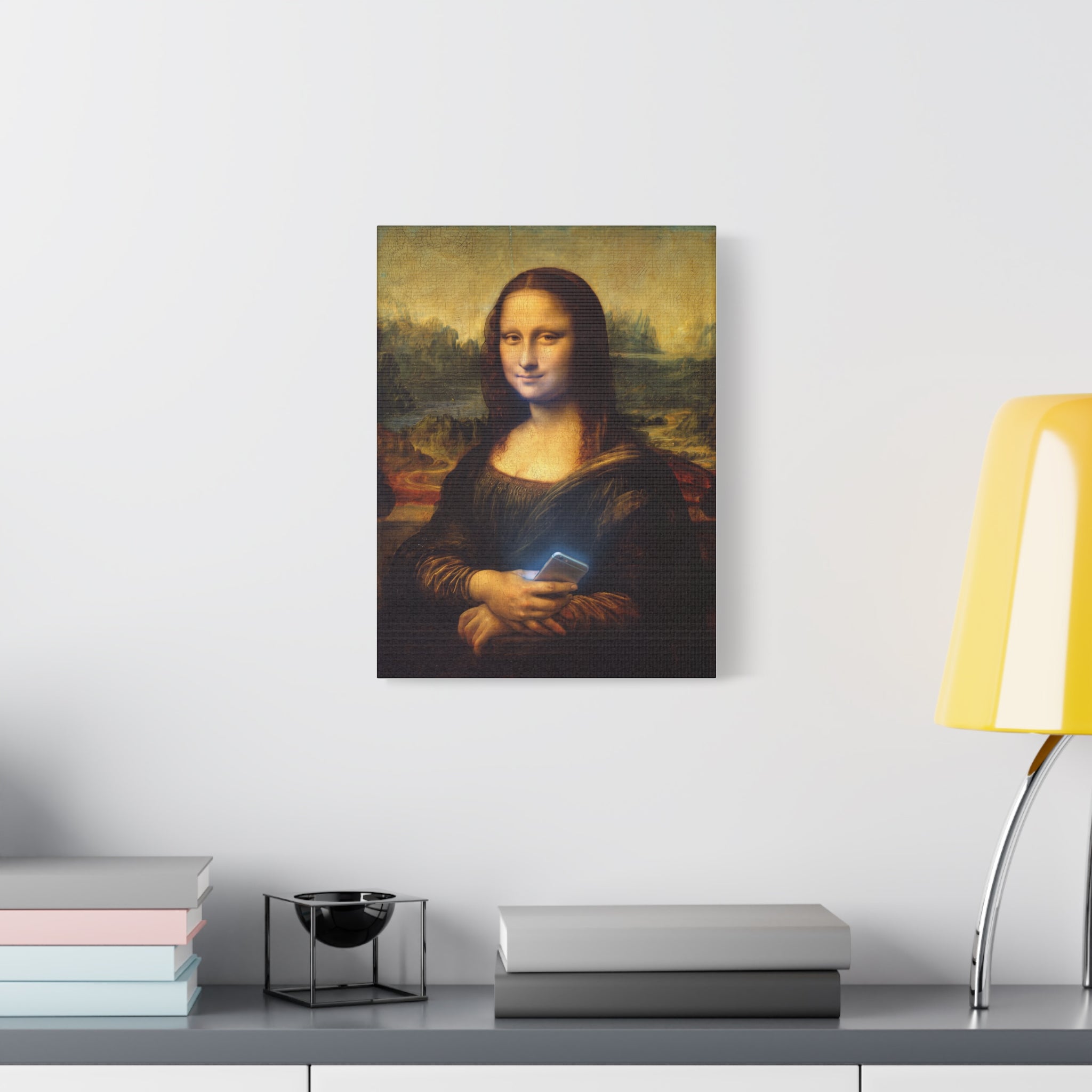 Small matte canvas wall art of Mona Lisa holding a glowing smartphone on wall