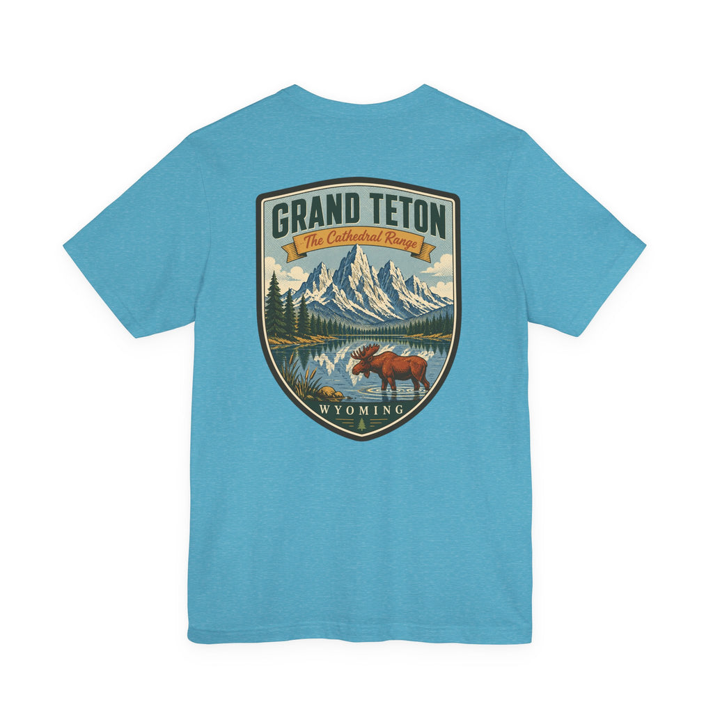 Heather aqua t-shirt with centered vintage Grand Teton Wyoming shield graphic