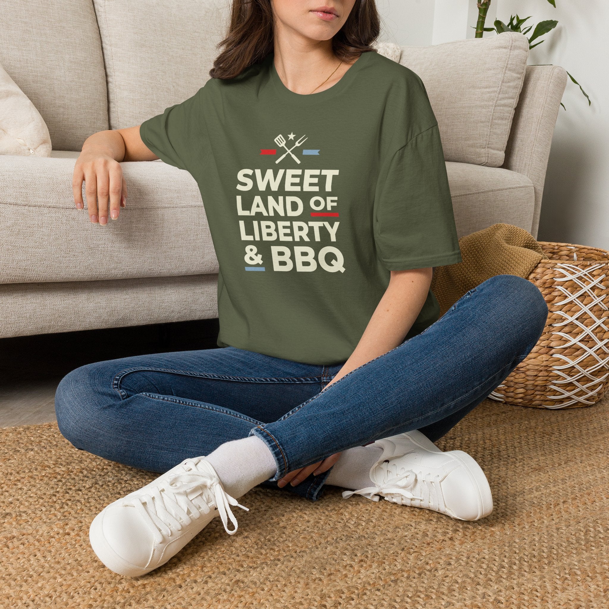 Military green 4th of July BBQ T-shirt with “Sweet Land of Liberty & BBQ” graphic on model