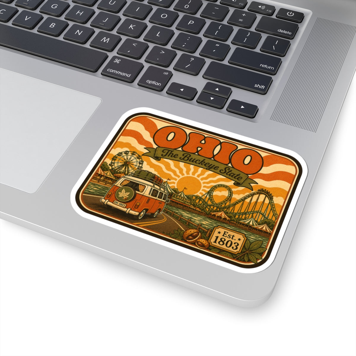 Ohio retro sticker on laptop, orange camper van and roller coaster, Est. 1803