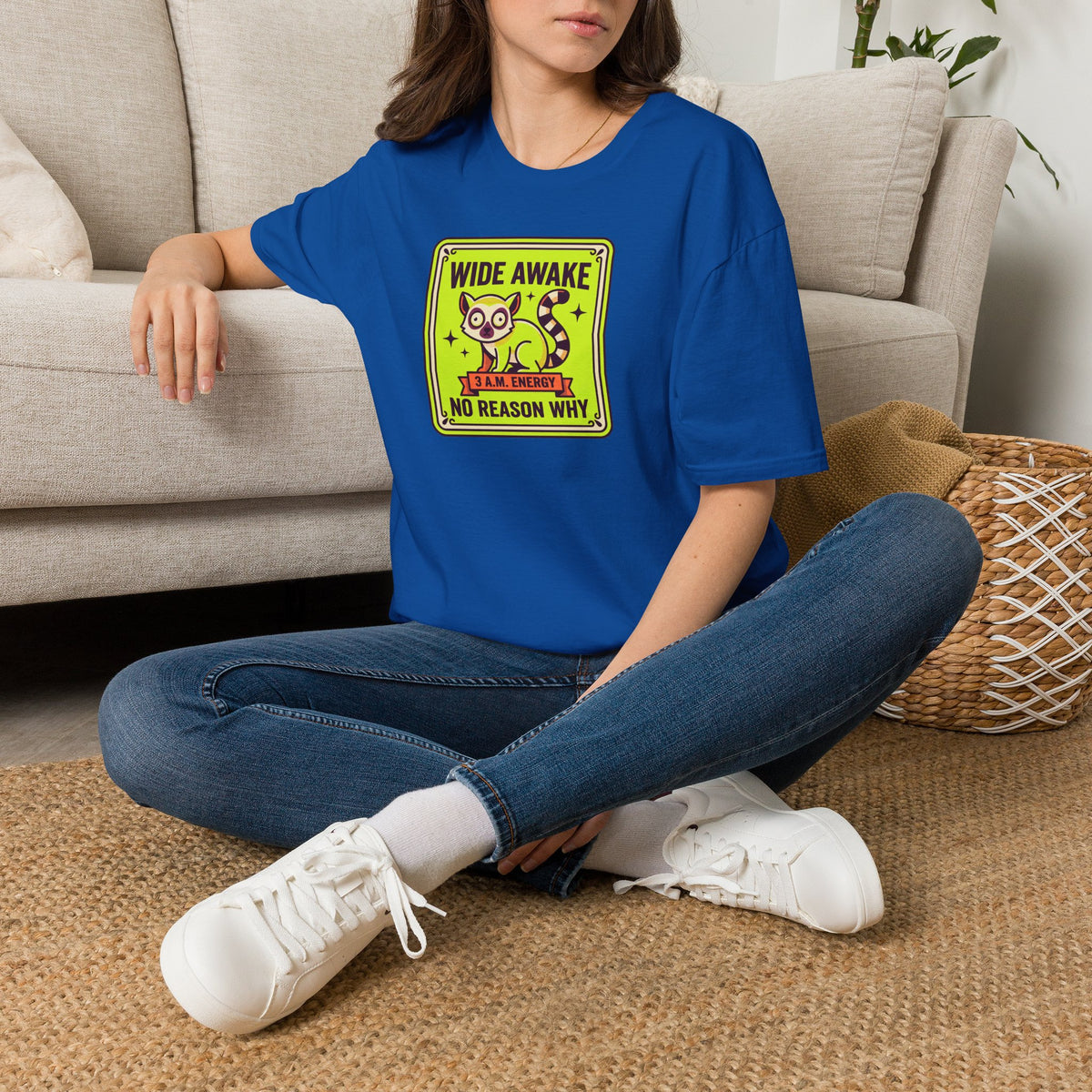 Royal blue cat graphic T-shirt worn by model, “Wide Awake” front print
