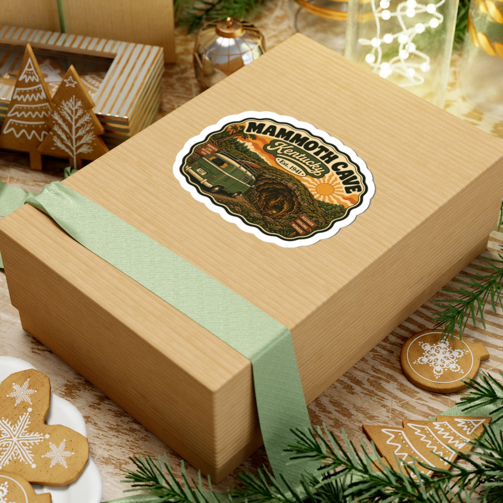 Die-cut Mammoth Cave Kentucky sticker showing vintage green camper van, cave, and sunset sun