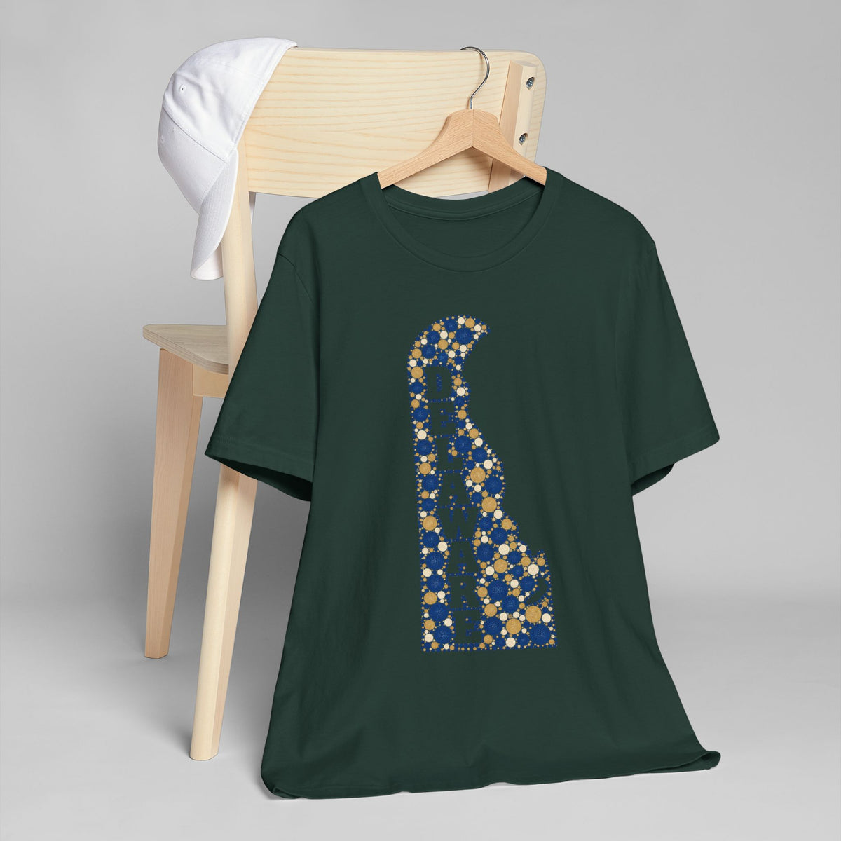 Dark green Delaware silhouette graphic T-shirt with blue and gold mosaic pattern